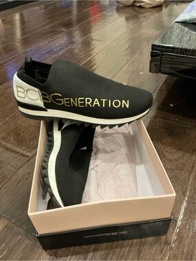 BCBGeneration Black Slip-On Knit Sneaker with Gold Logo